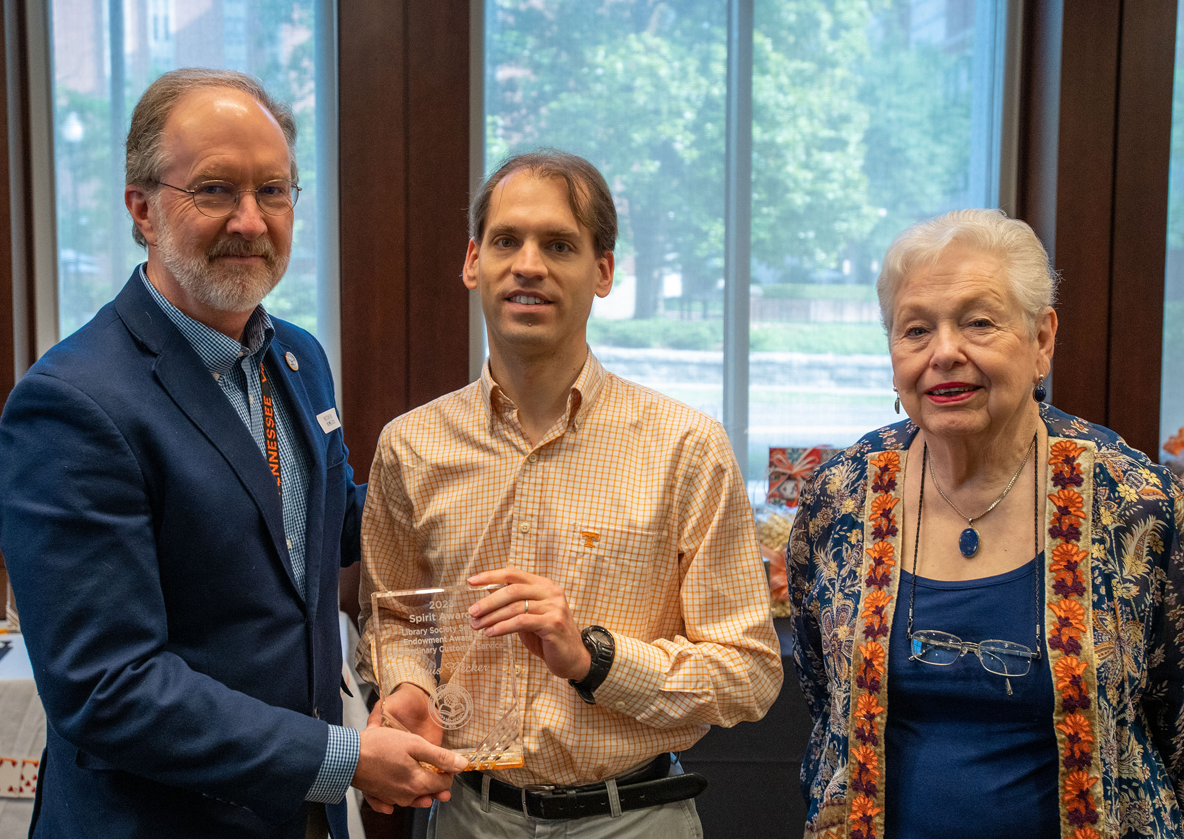 Louis Becker, center, with Smith and Lillian Mashburn of the John C. Hodges Society Advisory Board