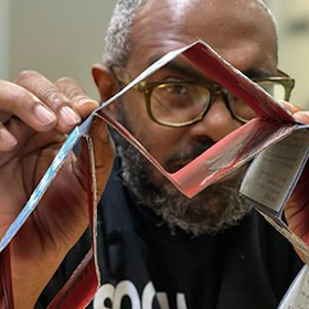 Black Atticus explores items in Special Collections at UT Libraries