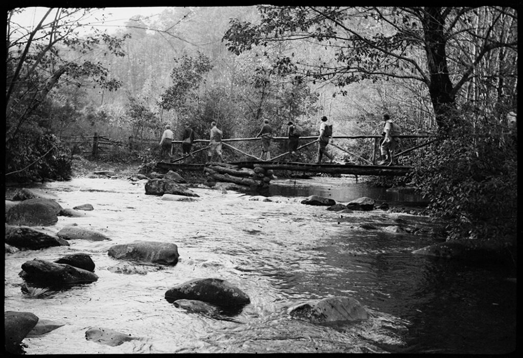 Hikers crossing a footbridge, Ridge Gregory Ridge trail 
