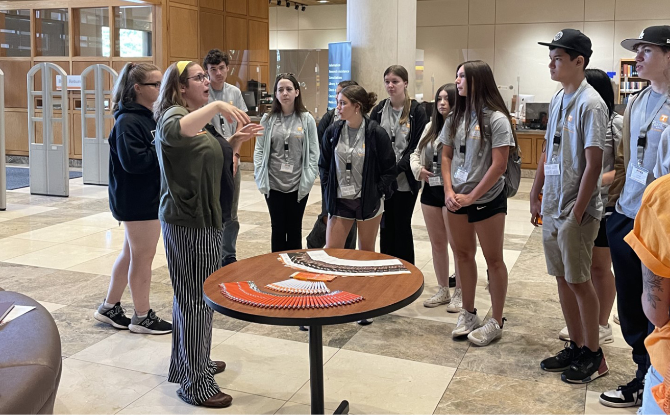 UT librarian Calantha Tillotson speaks to PiPES Explorers Camp students prior to a Hodges Library scavenger hunt.