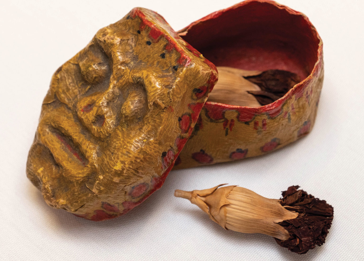 dried flowers in a papier-mâché box