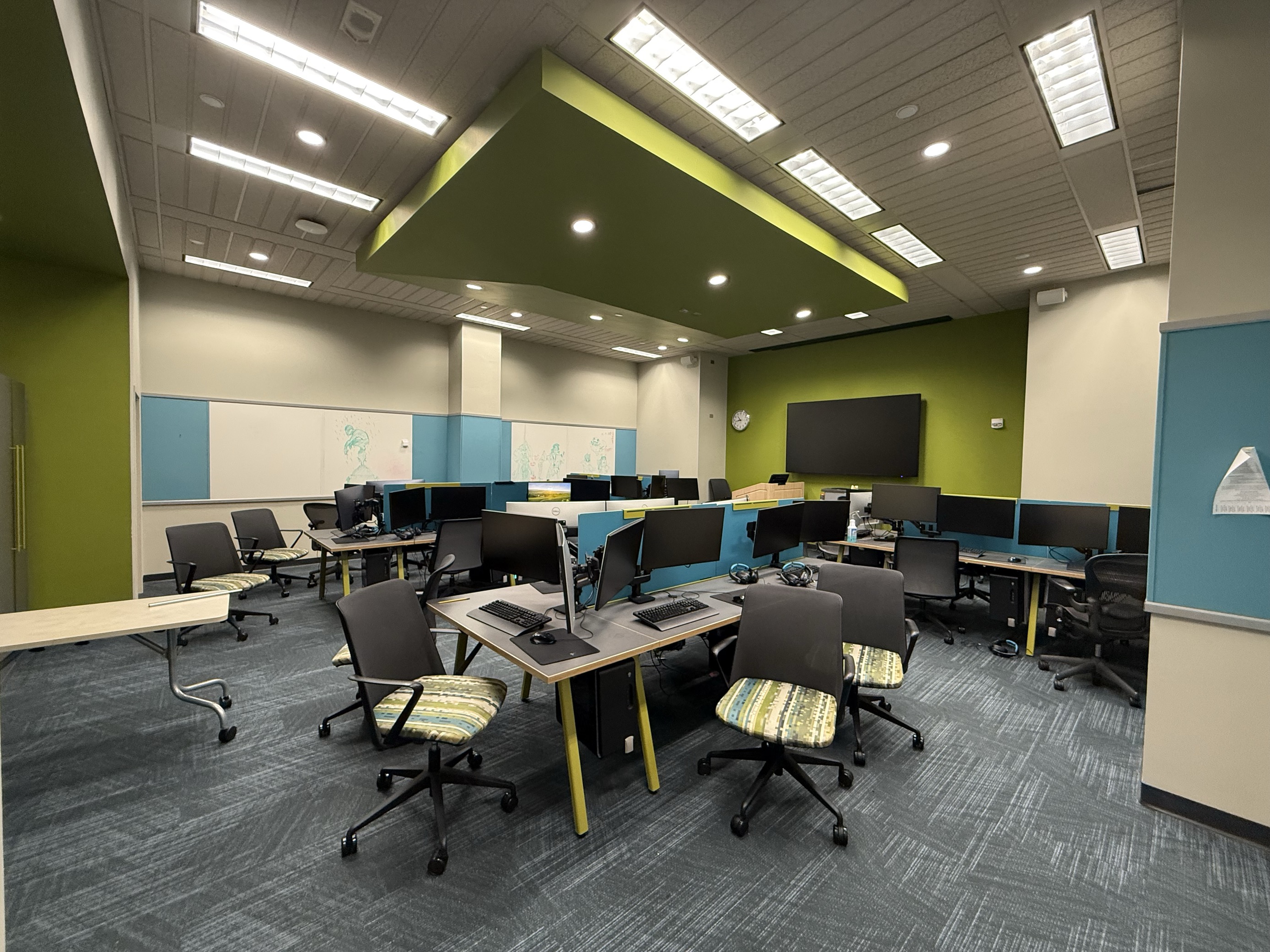 photo of chairs, tables, and computers in the gaming lab