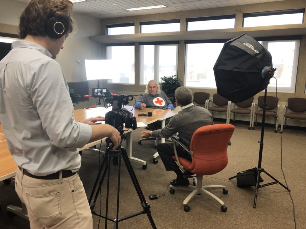 Videographer records interview as part of oral history project