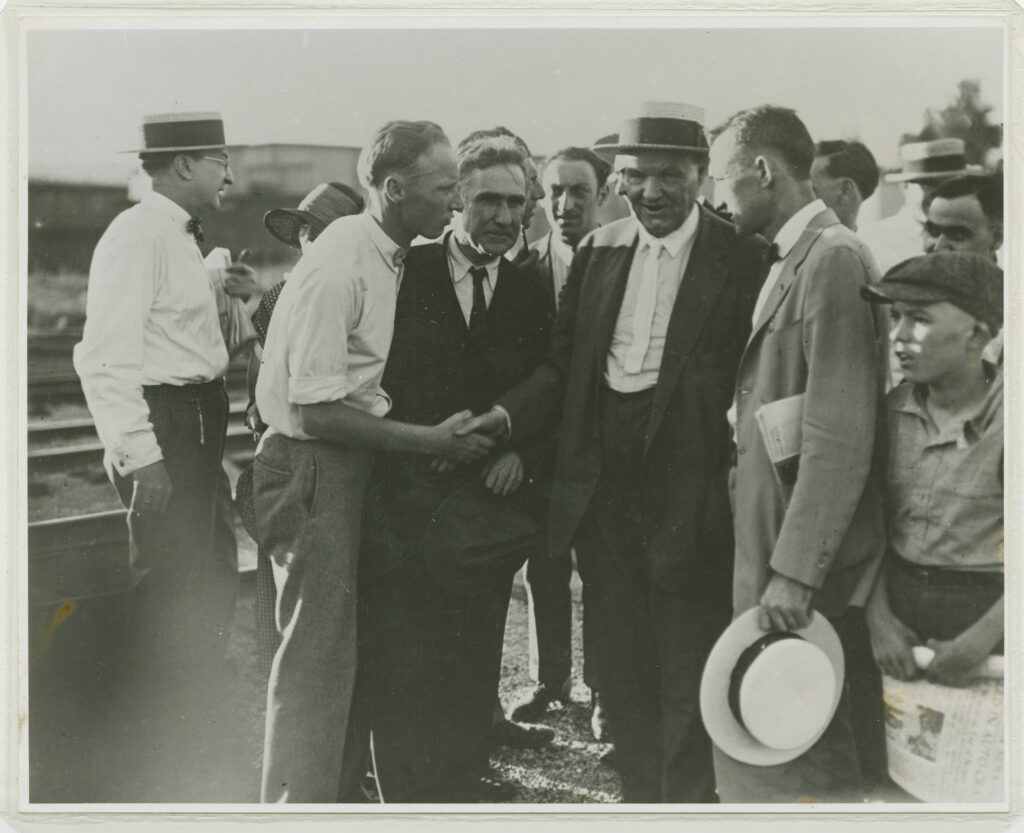 John Thomas Scopes greets his defense attorney, Clarence Darrow