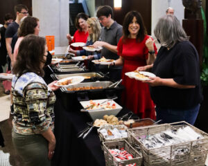 Library Faculty and Staff Members in the breakfast food line